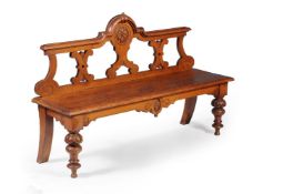 A Victorian oak hall seat