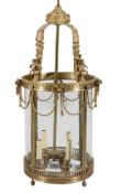 A substantial gilt metal and glazed four light hall lantern in Regency taste