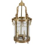 A substantial gilt metal and glazed four light hall lantern in Regency taste