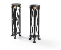 A pair of ebonised, parcel gilt and granite mounted torchères