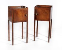 A pair of George III mahogany bedside cupboards