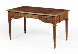 A 'plum pudding' mahogany and gilt metal mounted partners writing desk