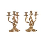 A pair of Rococo Revival gilt bronze three light candelabra