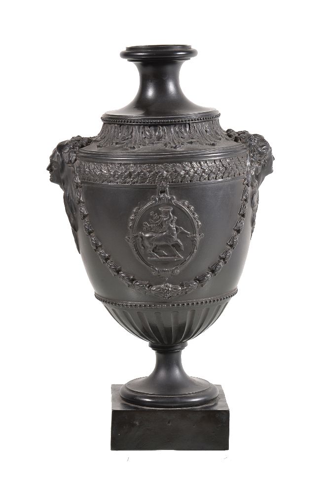 A Neale & Co. black basalt urn with mask handles