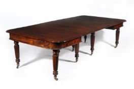 A George IV mahogany and marquetry extending dining table