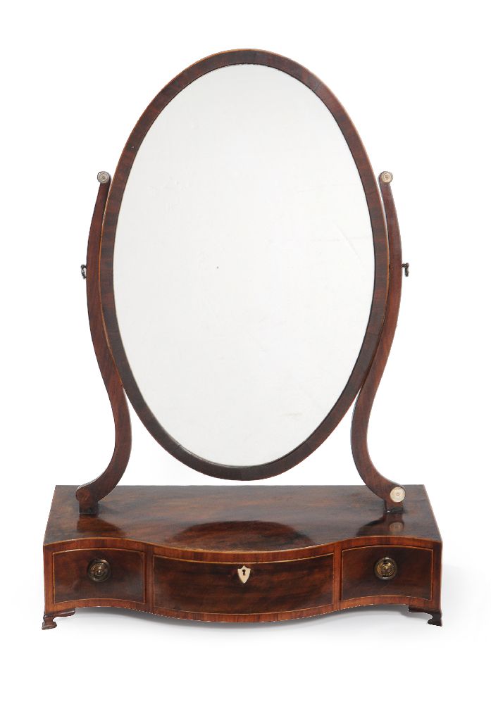 A George III mahogany serpentine fronted dressing mirror