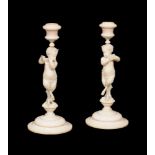 ϒ A pair of fine sculpted ivory figural candlesticks in Neoclassical style
