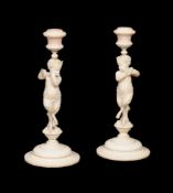 ϒ A pair of fine sculpted ivory figural candlesticks in Neoclassical style