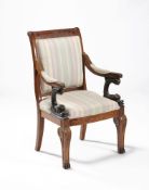 A Louis Philippe walnut and upholstered armchair