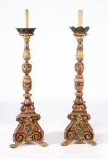 A pair of Continental giltwood and painted torcheres
