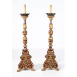 A pair of Continental giltwood and painted torcheres