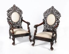 ϒ A pair of Ceylonese padouk or hardwood armchairs