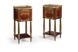 A pair of French mahogany and gilt brass mounted bedside cupboards