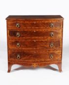 ϒ A George III mahogany and crossbanded bowfront chest of drawers