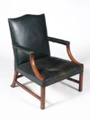 A George III mahogany and upholstered armchair