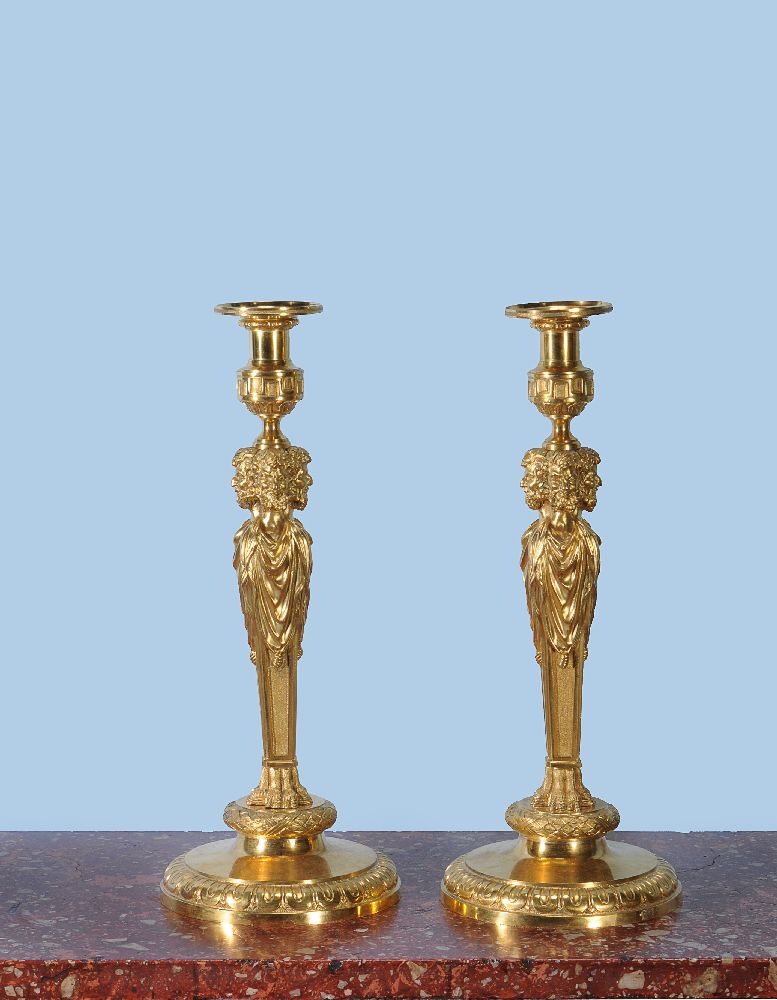 A pair of fine and substantial gilt bronze candlesticks