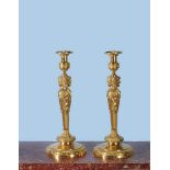 A pair of fine and substantial gilt bronze candlesticks