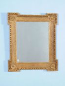 A George II giltwood and gesso wall mirror