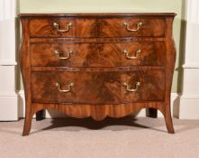 A George III mahogany serpentine commode