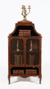 ϒ A French tulipwood, kingwood and gilt metal mounted bookcase or cabinet, in Louis XVI style