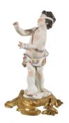 A Meissen model of a putto mounted on an ormolu base