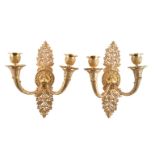 A pair of English or French ormolu twin light wall appliques
