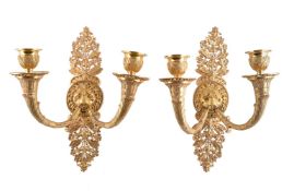 A pair of English or French ormolu twin light wall appliques