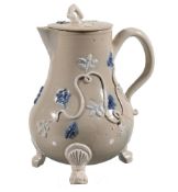 A Staffordshire salt-glazed stoneware drab bodied milk jug and cover