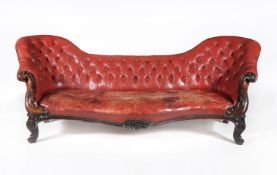 A Victorian rosewood and buttoned leather upholstered sofa