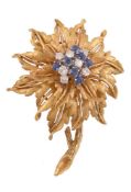 A 1960s diamond and sapphire en tremblant flower head brooch