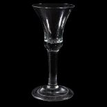 A large plain-stemmed wine glass, circa 1740, the bell bowl with solid basal section with bead