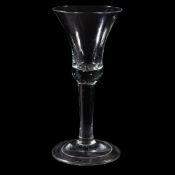 A large plain-stemmed wine glass, circa 1740, the bell bowl with solid basal section with bead