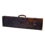 A leather and brass-bound gun case, early 20th century, for a single gun, 9cm x 83cm x 22.5cm