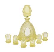 A Czechoslovakian yellow glass annagelb press-moulded and frosted glass spirit set, circa 1960,