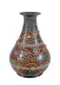 A Doulton Lambeth stoneware baluster vase by George Tinworth, scroll foliage in bands of brown and