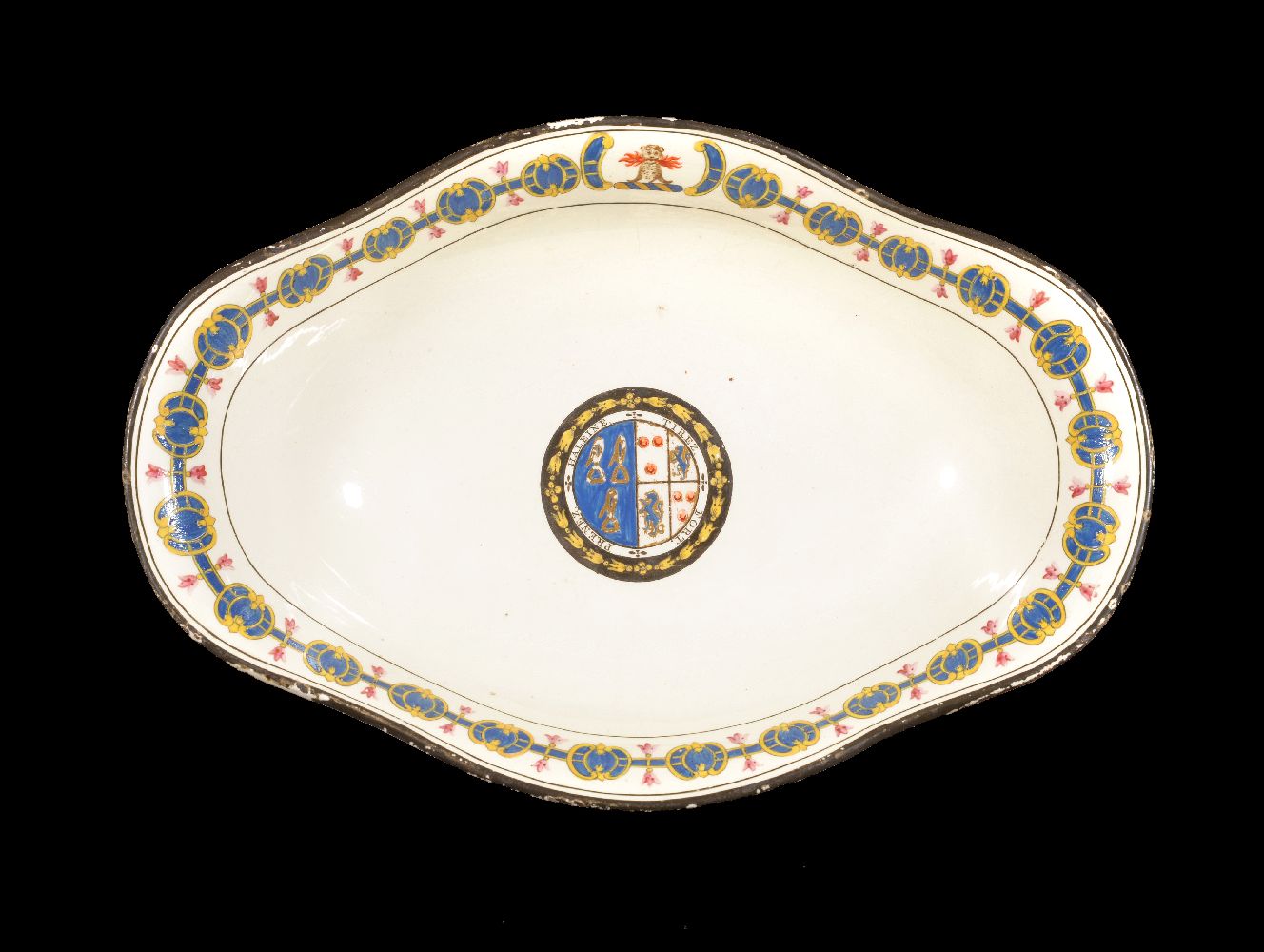 A Turner creamware crested and armorial quatrefoil bowl, late 18th century, decorated with a