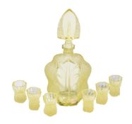 A Czechoslovakian yellow glass annagelb press-moulded and frosted glass spirit set, circa 1960,