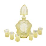 A Czechoslovakian yellow glass annagelb press-moulded and frosted glass spirit set, circa 1960,