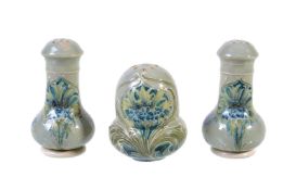 William Moorcroft for James Macintyre & Co., three Florian ware Cornflower pepper pots, circa