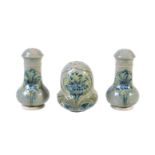 William Moorcroft for James Macintyre & Co., three Florian ware Cornflower pepper pots, circa