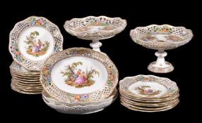 A Dresden porcelain part dessert service, late 19th century, painted with Watteauesque scenes within