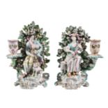 A pair of Derby porcelain figural candlesticks of a shepherd and companion, circa 1770, modelled