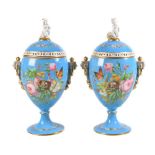 A pair of French porcelain turquois-ground ovoid pedestal pot-pourri vases and covers, third quarter