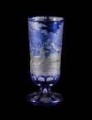 A Bohemian clear-glass and engraved blue-flashed tall slender goblet, third quarter 19th century,