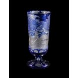 A Bohemian clear-glass and engraved blue-flashed tall slender goblet, third quarter 19th century,