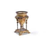 A French champlevé enamel and gilt metal mounted onyx Orientalist urn in stand in the manner of