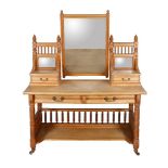 An Aesthetic Movement ash dressing table by Heal & Son, circa 1890, with galleried and mirror backed