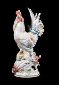 A Meissen model of a cockerel, 20th century, partially coloured and gilt, blue crossed swords