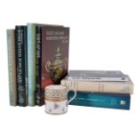 A Worcester (Flight & Barr) mug and seven reference books on Worcester porcelain, the mug circa