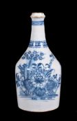 An English delft blue and white chinoiserie water bottle, circa 1770, painted with flowers, 27cm